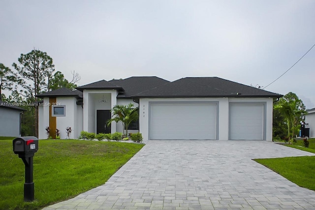 view of front facade with a garage and a front yard