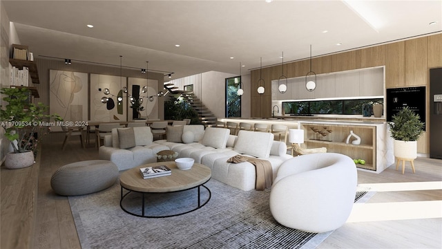 living room featuring light hardwood / wood-style flooring and wooden walls