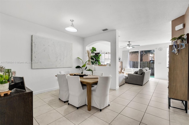 tiled dining room with ceiling fan