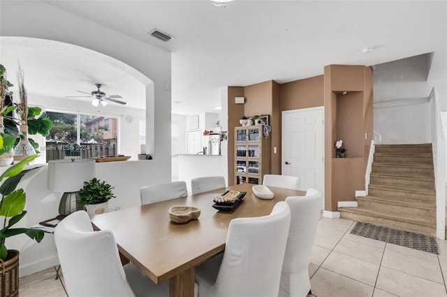 dining room with light tile patterned floors and ceiling fan