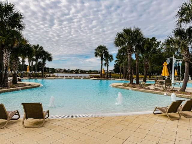 view of pool with pool water feature