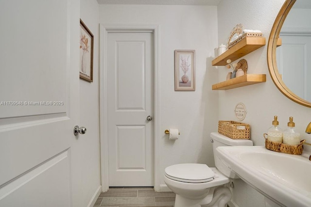 bathroom with sink and toilet