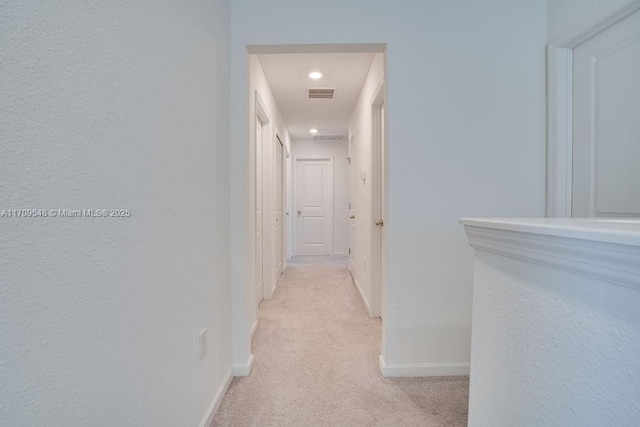 hallway with light carpet