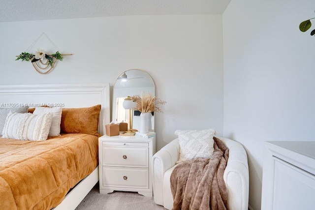 bedroom featuring light colored carpet