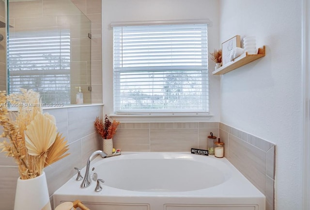 bathroom featuring a tub to relax in