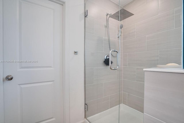 bathroom with a shower with shower door