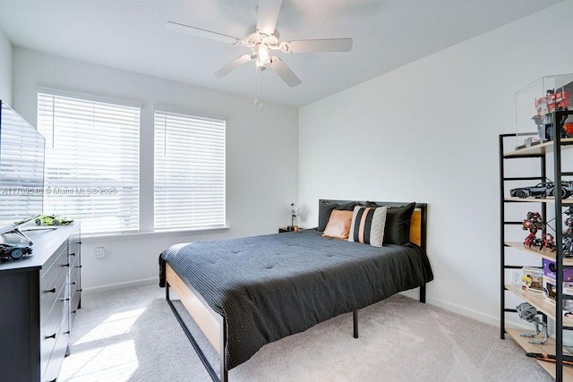 bedroom featuring ceiling fan and light colored carpet