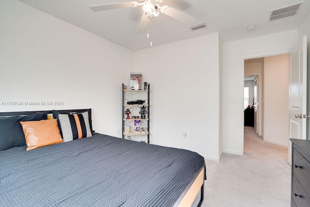 bedroom with ceiling fan and light colored carpet