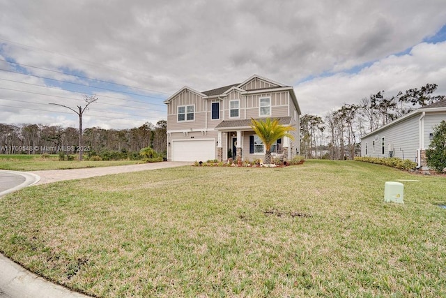 view of front of property with a front yard and a garage