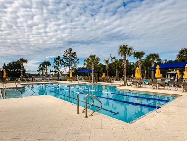 view of swimming pool with a patio