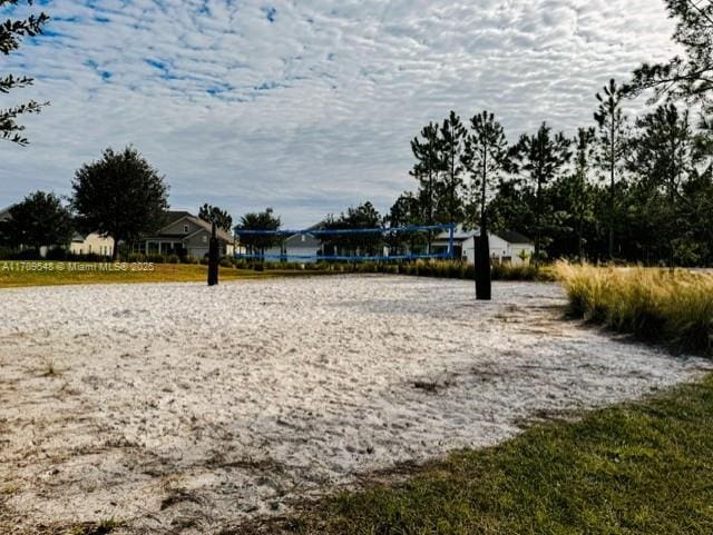 surrounding community featuring volleyball court