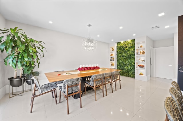 dining space with light tile patterned flooring and an inviting chandelier