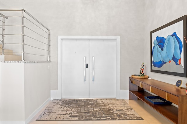 foyer entrance with tile patterned flooring