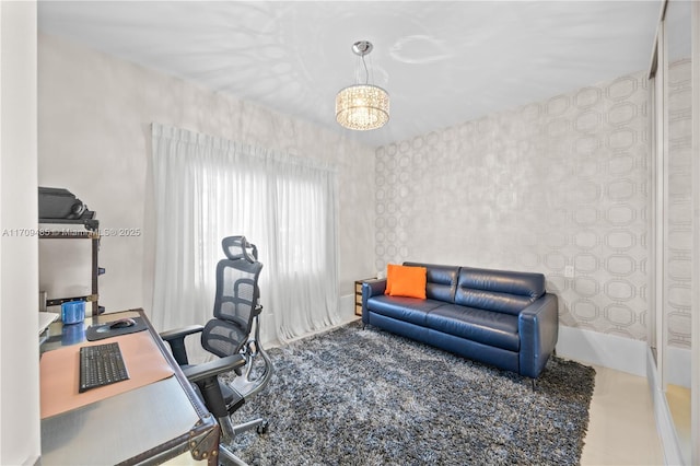 carpeted home office featuring an inviting chandelier