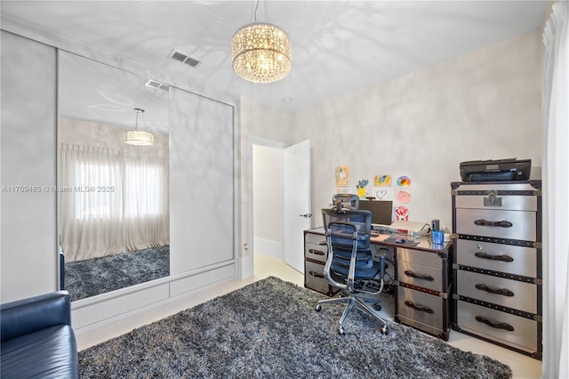 home office featuring a chandelier