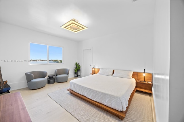 bedroom with light hardwood / wood-style floors