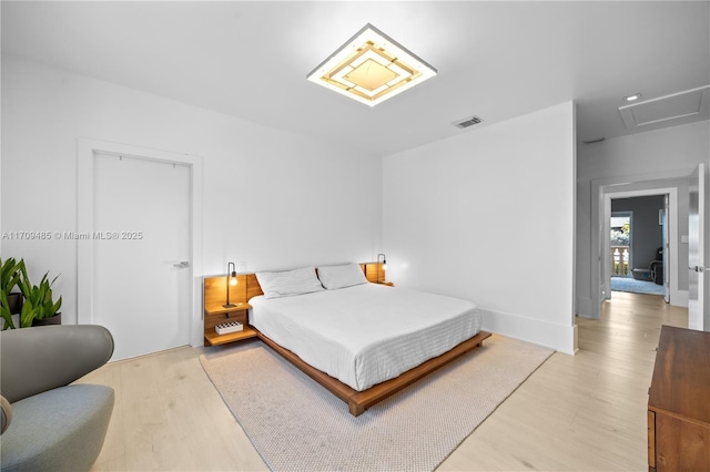 bedroom with light hardwood / wood-style floors