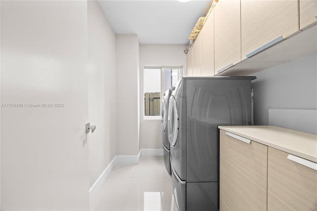 laundry area featuring cabinets and washer and dryer