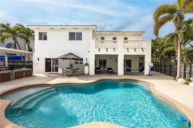 view of swimming pool with a patio