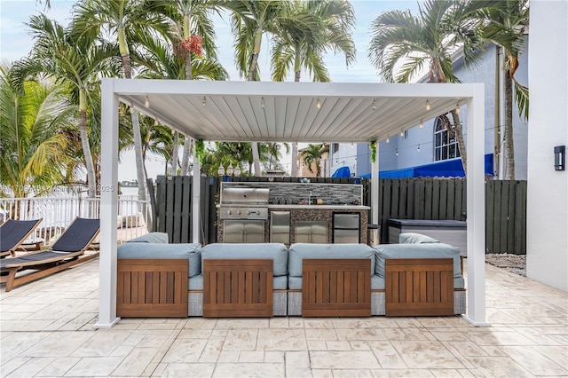 view of patio / terrace with grilling area, an outdoor living space, and an outdoor kitchen