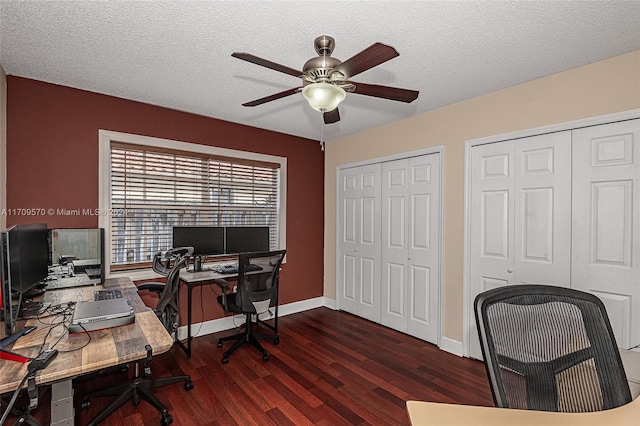 office area featuring dark hardwood / wood-style floors, ceiling fan, and a textured ceiling