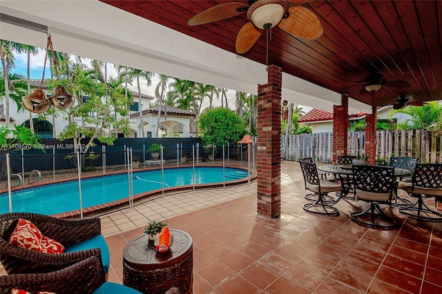 view of pool featuring a patio area and ceiling fan