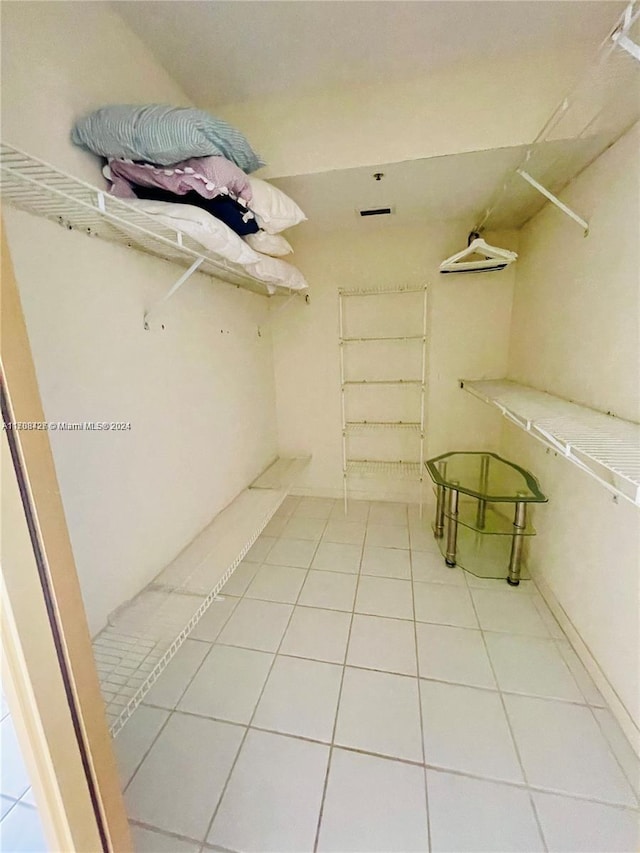 spacious closet featuring tile patterned flooring