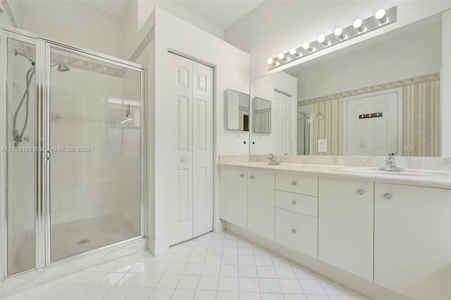 bathroom featuring vanity and an enclosed shower