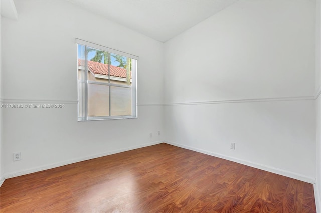 spare room featuring hardwood / wood-style floors