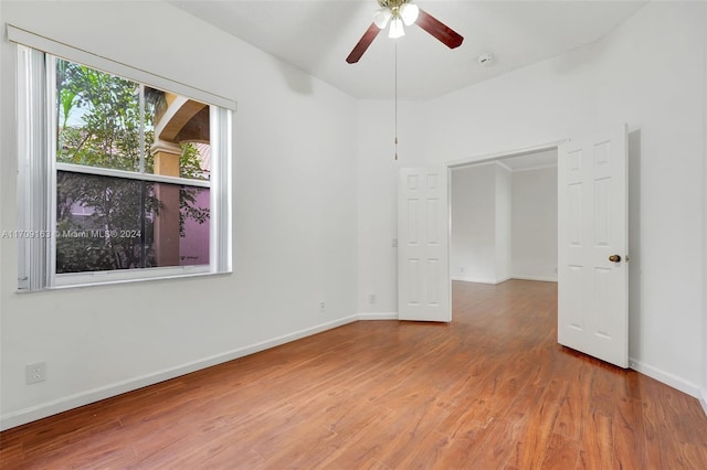 interior space with wood-type flooring and ceiling fan