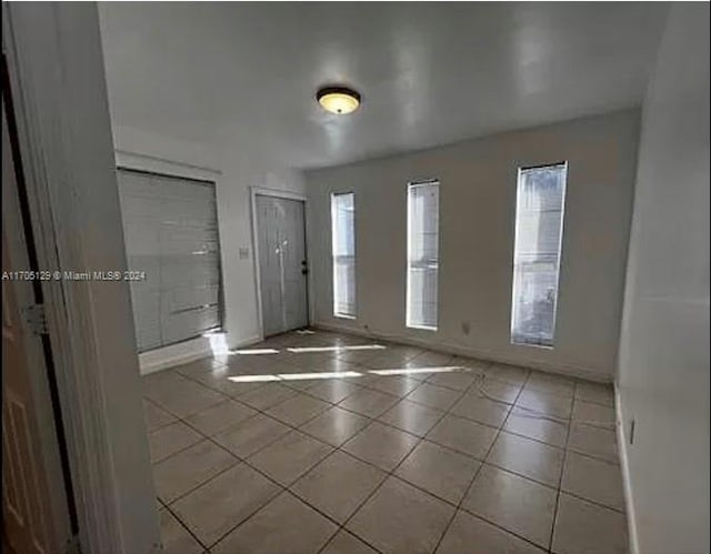 entryway featuring light tile patterned floors