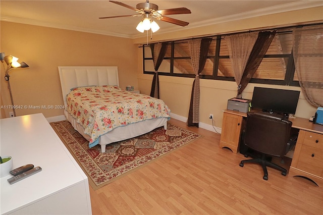 bedroom with ceiling fan, light wood-type flooring, and crown molding