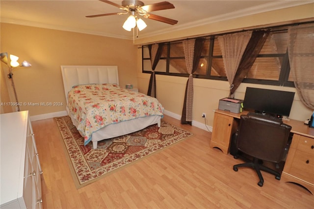 bedroom featuring ceiling fan, light wood-type flooring, and crown molding