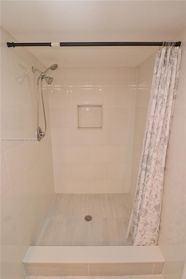 bathroom featuring walk in shower