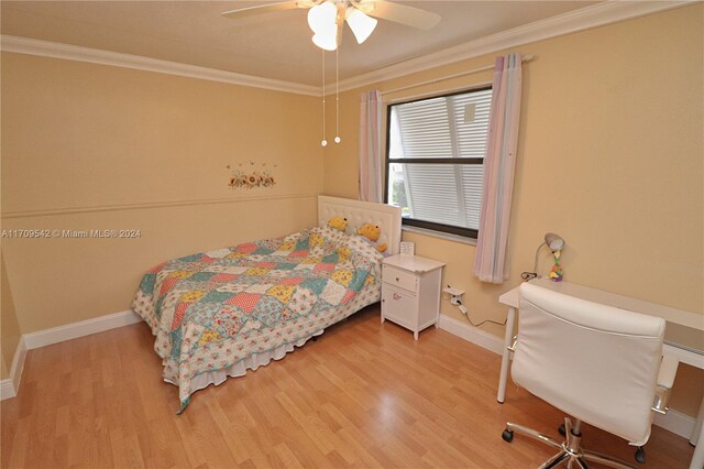 bedroom with ceiling fan, crown molding, and light hardwood / wood-style floors