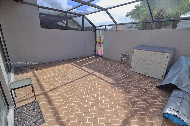 view of patio with a lanai