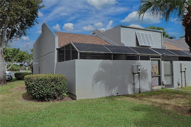 view of property exterior with a yard