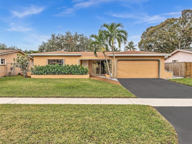8910 NW 7th Ct, Pembroke Pines, FL 33024 - ranch-style home with stucco siding, driveway, and a garage