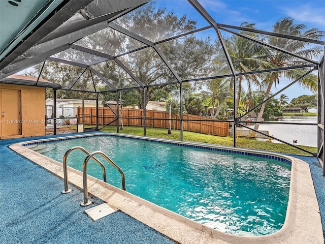 8910 NW 7th Ct, Pembroke Pines, FL 33024 - view of pool with a fenced backyard, glass enclosure, a patio area, and a water view