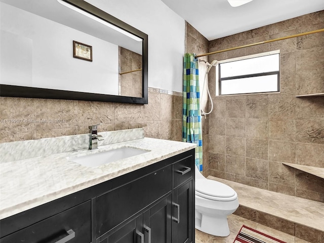 bathroom with walk in shower, vanity, tile walls, and toilet