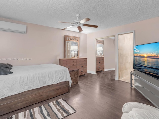 bedroom with a textured ceiling, a wall mounted AC, ceiling fan, and dark hardwood / wood-style floors