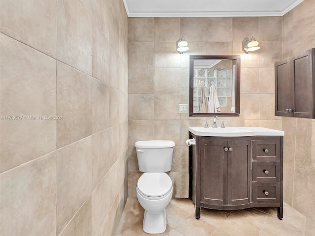 bathroom featuring vanity, tile patterned floors, tile walls, and crown molding