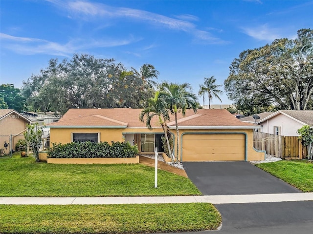 single story home with a garage and a front yard