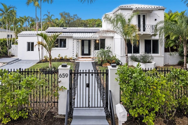 mediterranean / spanish-style house with a balcony