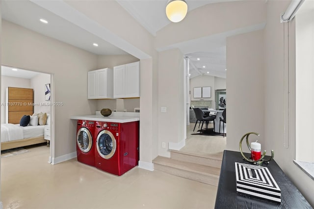 laundry area with cabinets and washing machine and dryer