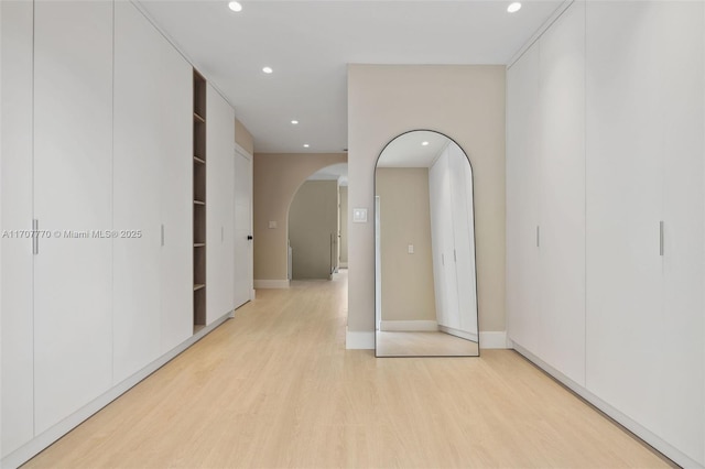 hall with light hardwood / wood-style flooring