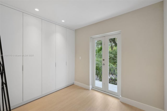 interior space featuring light hardwood / wood-style floors and french doors