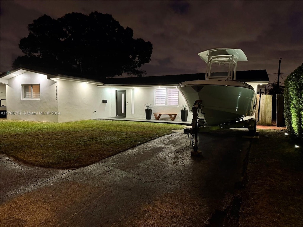 view of front of home with a yard