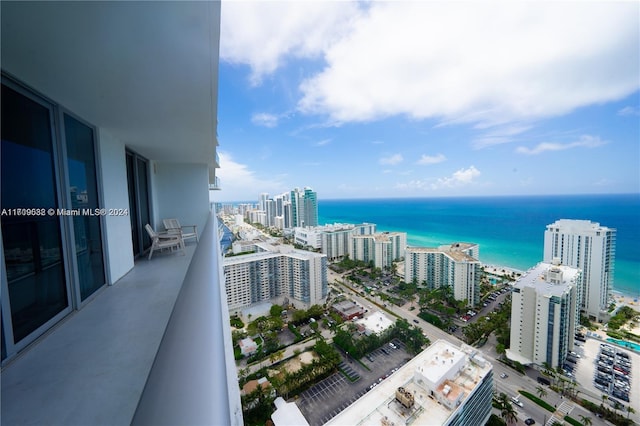 balcony featuring a water view