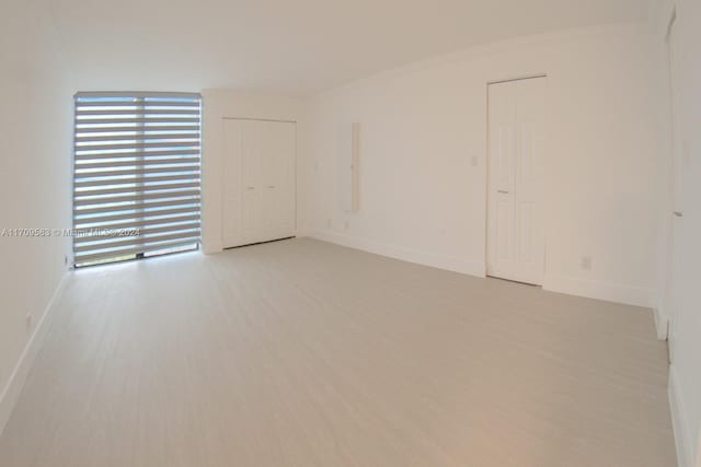 unfurnished room featuring light hardwood / wood-style flooring